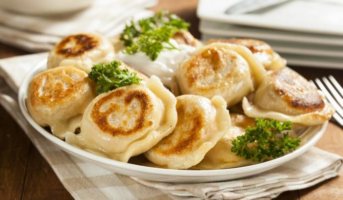 Fried dumplings with sour cream and herbs
