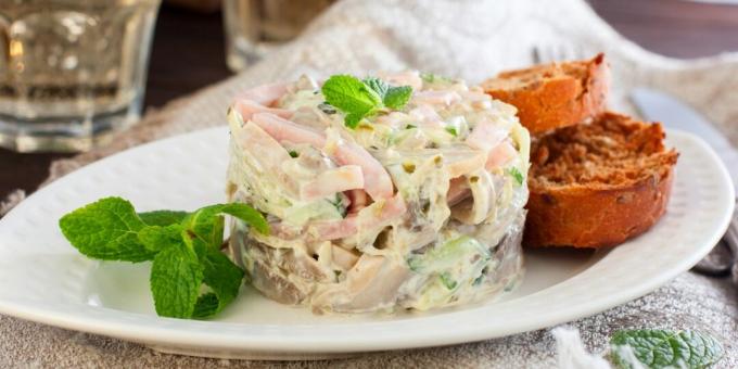 Salad with ham, cucumbers and pickled mushrooms