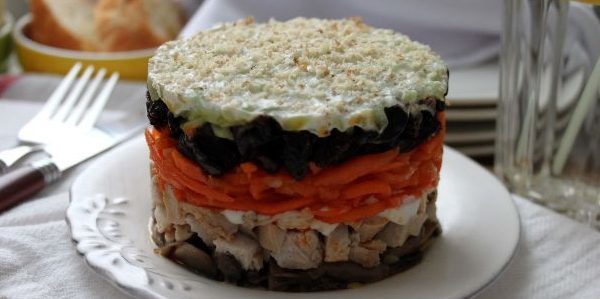 Puff salad with prunes, chicken, mushrooms, Korean carrots and creamy dressing