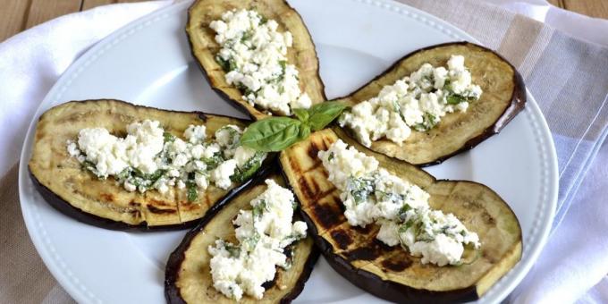 Eggplant on the grill with lemon juice, feta and basil