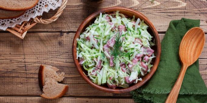 Salad with sausage, cabbage and pickled onions