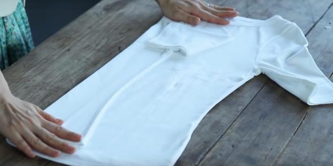 Fold the left side to the middle and fold the sleeve