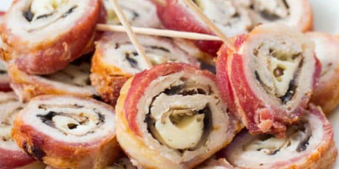 Pork in the oven: Rolls of pork wrapped in bacon stuffed with mushrooms and cheese