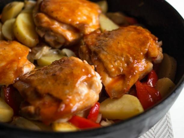 Pour the glaze over the chicken and vegetables and place in the oven