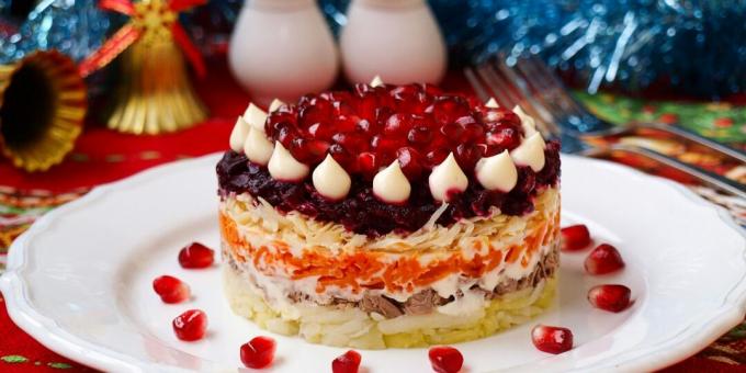 Layered salad with beef and pomegranate
