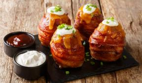 Bacon-wrapped potatoes stuffed with cheese