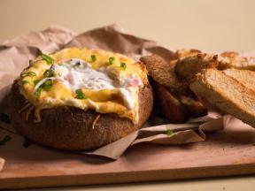 Ideas for a party: a bread bowl with cheese dip sauce