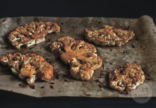 Grease each cauliflower steak with sauce and return to the oven