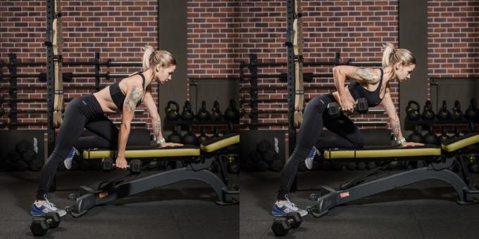 The training program for young women in the gym: dumbbell thrust to his waist in the slope