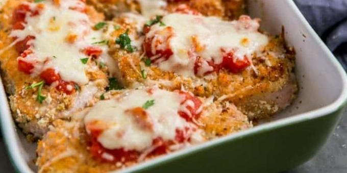 Pork chops with tomato and cheese