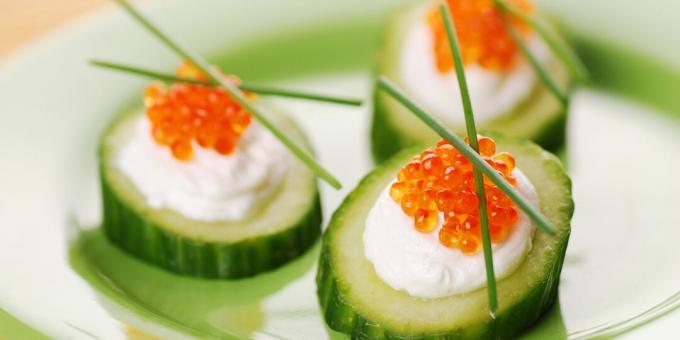 Appetizer of cucumber with red caviar