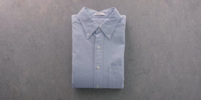 As sleeved shirt folded down with the paper sheet