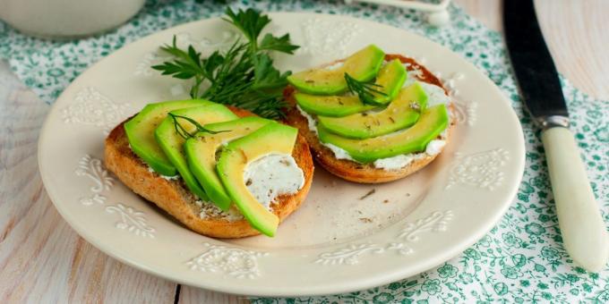 Sandwiches with avocado, cheese and herbs