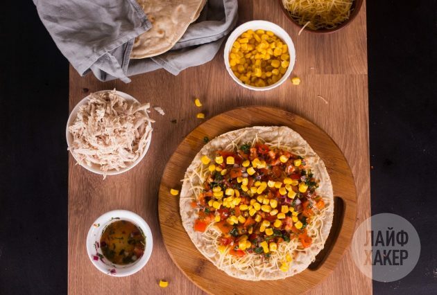 Top up the quesadilla filling with chicken, corn and tomato salsa