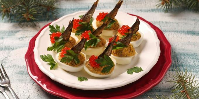 Stuffed eggs with sprats and red caviar