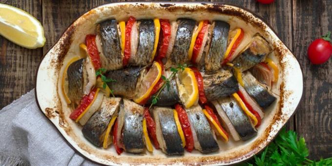 Herring baked in the oven with lemon and vegetables