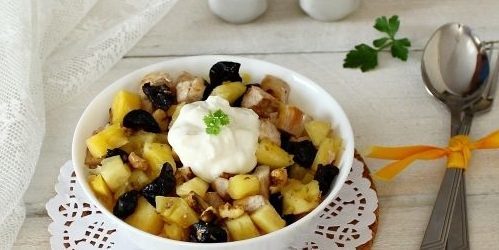 Salad with prunes, chicken, pineapple and nuts