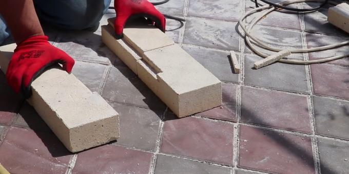 Lay dry, two fireclay bricks at the side walls and one at the back.