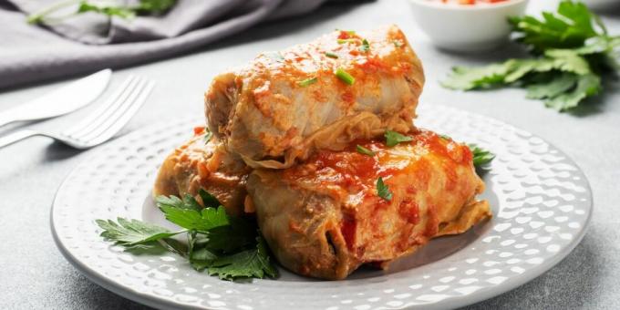 Stuffed cabbage rolls baked in the oven with sour cream and tomato sauce