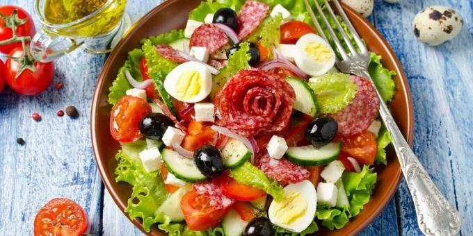 Salad with sausage, cucumbers, tomatoes and cheese