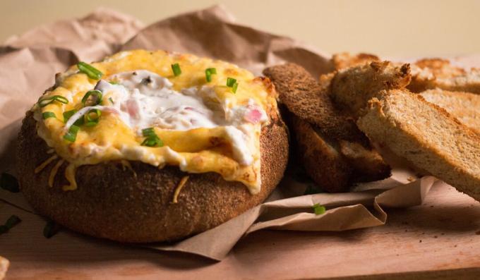 Bread bowl with cheese sauce dip