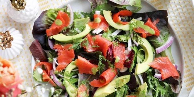 Salad with red fish, avocados, greens and onions