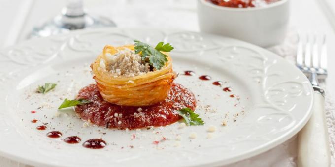 Nests of pasta with minced meat baked in the oven