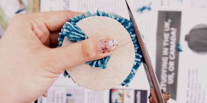 Trim the edges of the pompom