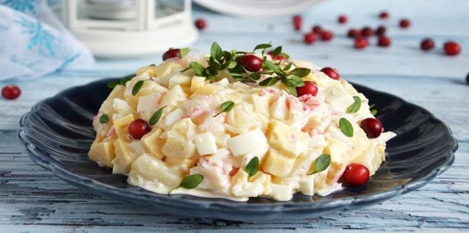 Salad with crab sticks, pineapple, cheese and eggs