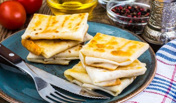 Lavash envelopes with sausage and cheese, baked in the oven