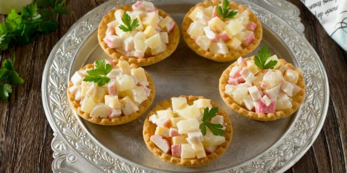 Tartlets with crab sticks and pineapple