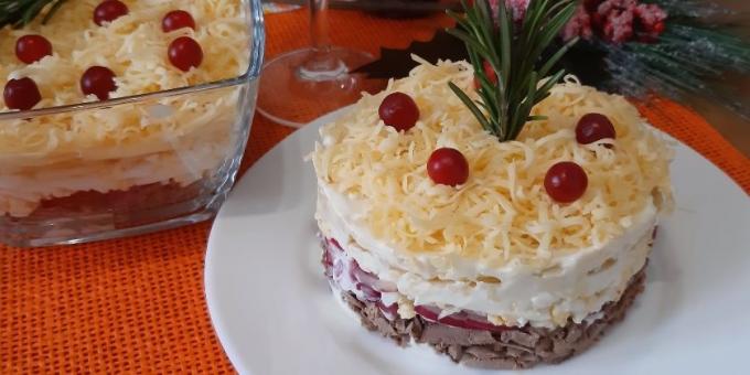 Puff salad with apple, chicken liver, eggs and cheese