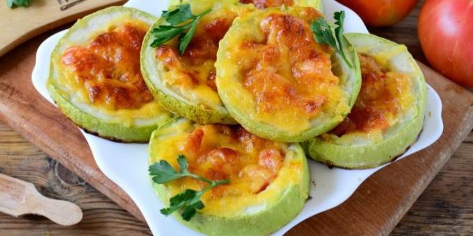 Zucchini stuffed with tomatoes and baked in the oven