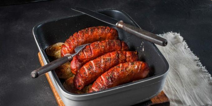 Sausages with onions in the oven