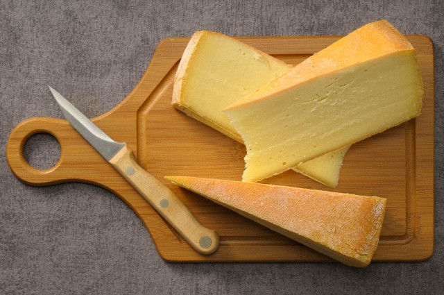 Bamboo cutting board, cheese on a bamboo board