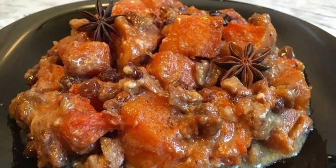 Pumpkin in the oven, baked in cream with nuts, raisins and spices