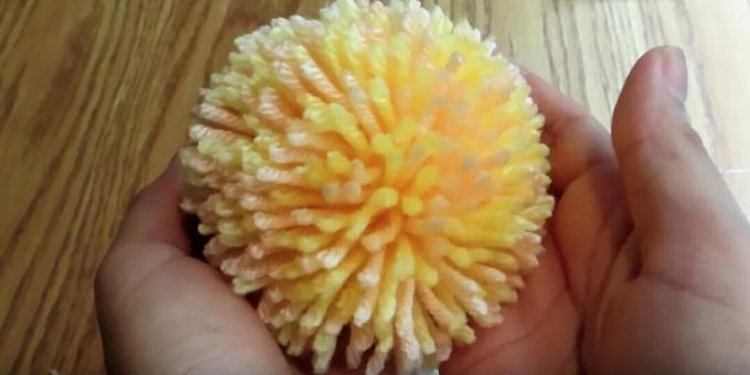 How to make a pom-pom using a piece of paper