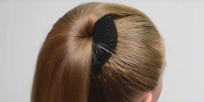 Make a high ponytail and insert it into a roll
