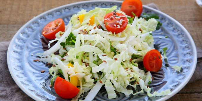 Salad from sea and chinese cabbage with cucumbers and tomatoes