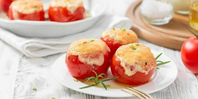 Stuffed tomatoes with cheese and minced meat baked in the oven