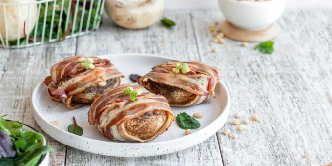 Champignons in bacon stuffed with cheese