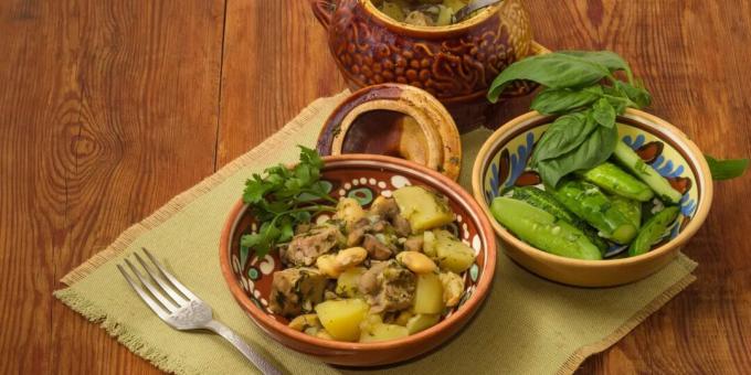 Pork with potatoes and beans in pots