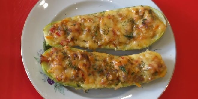 Baked zucchini stuffed with meat and rice