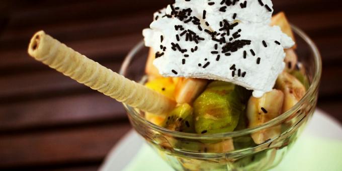 Fruit salad with whipped cream and chocolate