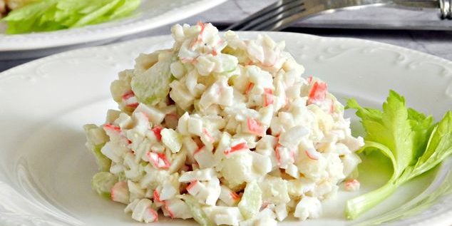 Salad with celery, crab sticks, apples and eggs