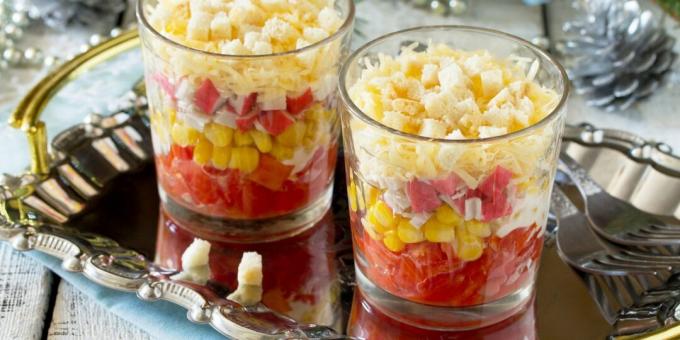 Layered salad with crab sticks and croutons