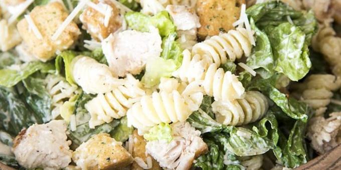 Caesar salad with chicken and pasta