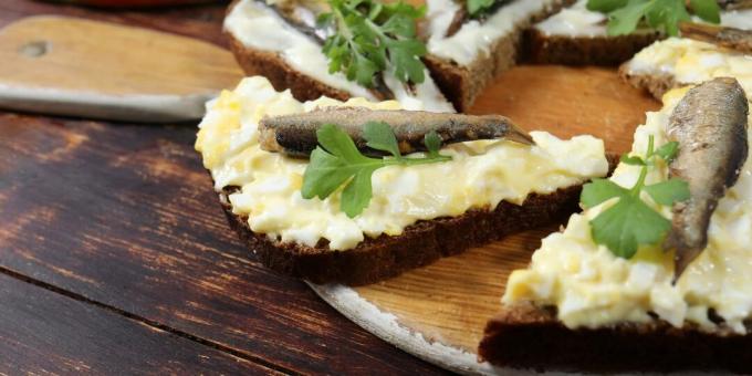 Sandwiches with sprats, egg and cheese