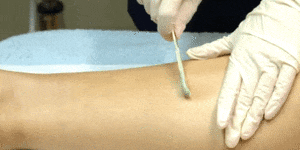 Waxing: applying hot wax
