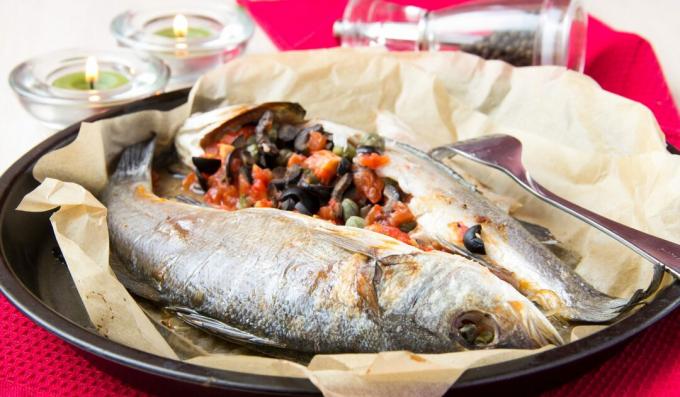 Stuffed sea bass with olives, tomatoes and fennel